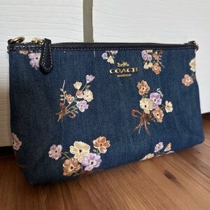 Coach zip top denim clutch with painted floral print